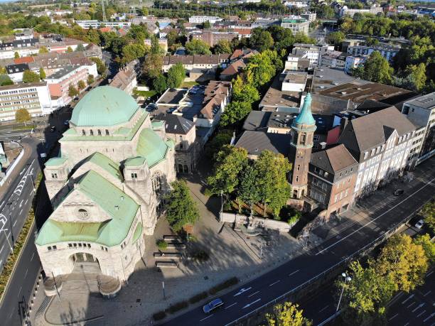 Essen city, Germany Essen city in Ruhr region, Germany. Aerial view of Old Synagogue and Friedenskirche church. essen germany stock pictures, royalty-free photos & images