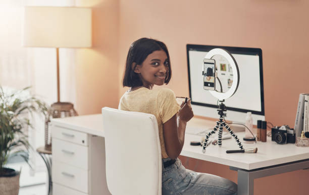 Your beauty is my business Portrait of a young woman using a computer while working from home streamer photos stock pictures, royalty-free photos & images