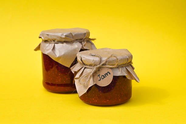 istock Set of two conserve jars with berries jam. 1302445728