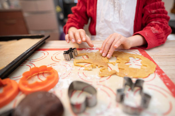istock Girl making cookies at home 1302445848