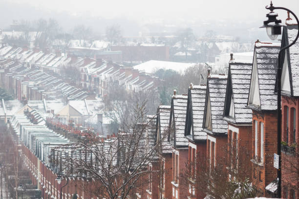 istock Identical terraced houses covered by snow in Crouch End, London 1302446432