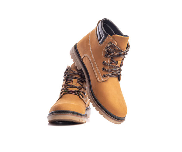 istock Yellow boots isolated on white background 1302446440