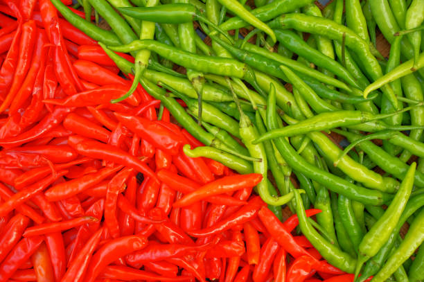 istock Green and red chili peppers 1302447802