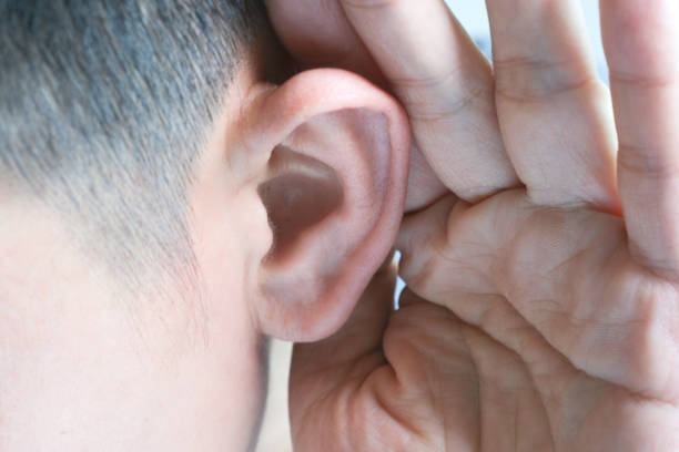 istock The young man touched his ear and he had a sore ear. 1302448845