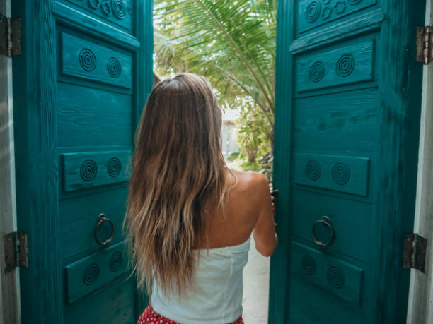 istock Woman checking in luxury beach villa 1302449296