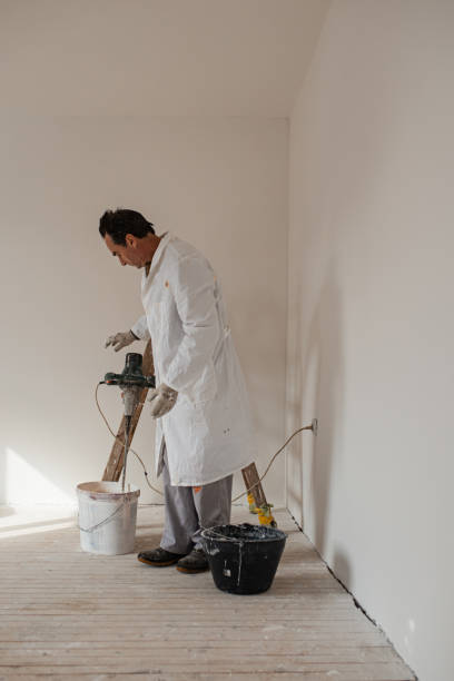 istock Senior manual worker finished using the electric mixer 1302450956