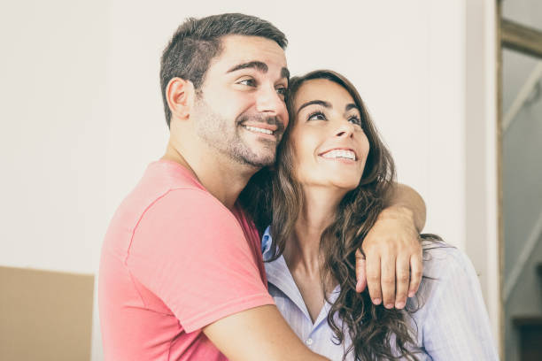 istock Joyful excited couple moving into new house 1302452269