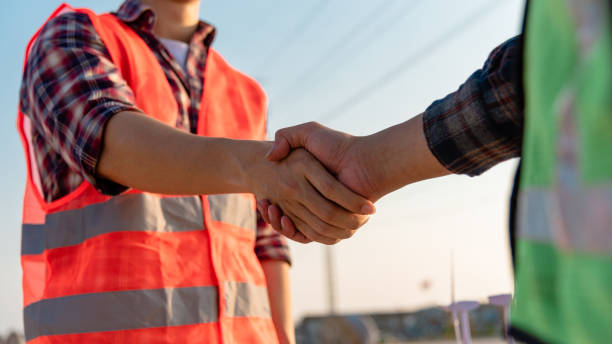 istock The engineer shake hands with the foreman to congratulate the completion of the work. 1302452339