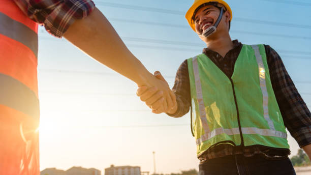 istock The engineer shake hands with the foreman to congratulate the completion of the work. 1302452355