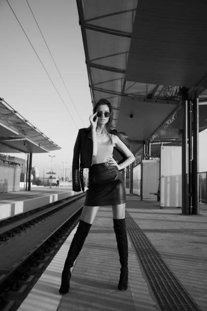 istock Sexy Woman Posing On Train Station BW 1302453450
