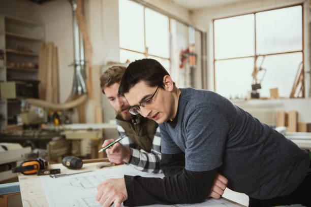 istock Carpenters working on furniture projects 1302453618