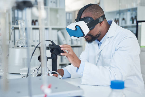 Advanced technology for advanced medical research Shot of a scientist using a virtual reality headset while conducting research in a laboratory medical technology stock pictures, royalty-free photos & images