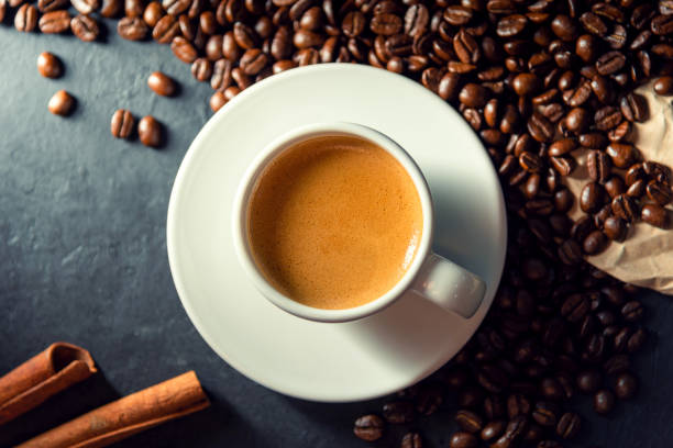 istock Espresso coffee With coffee beans in the morning background. 1302454449