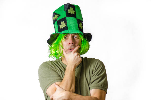 istock Man wearing green wig and hat for St. Patrick's day 1302454483