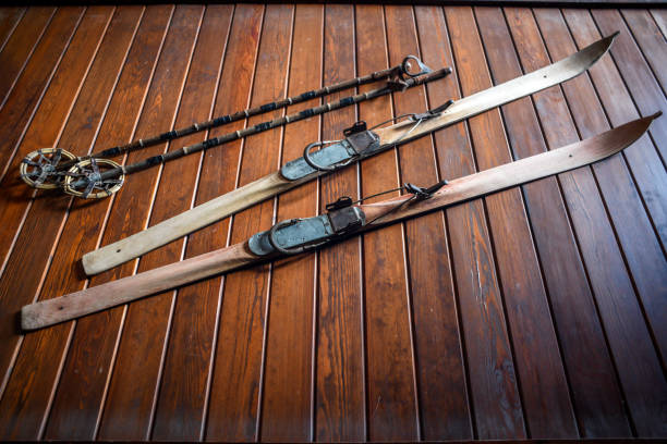 istock Old vintage skis with poles. 1302454835