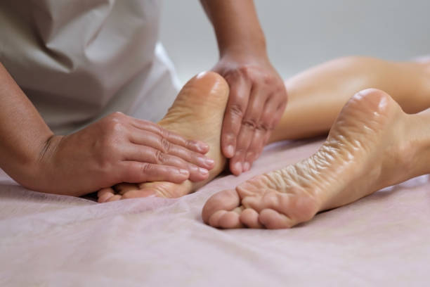 istock Foot massage in the spa salon at spa salon 1302456445