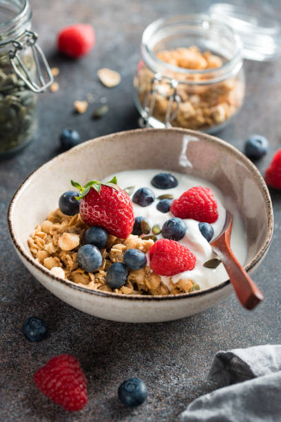 istock Healthy breakfast, cereal with berries and yogurt 1302456506