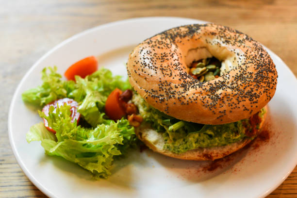 istock Vegan bagel with hummus and vegetables 1302459189
