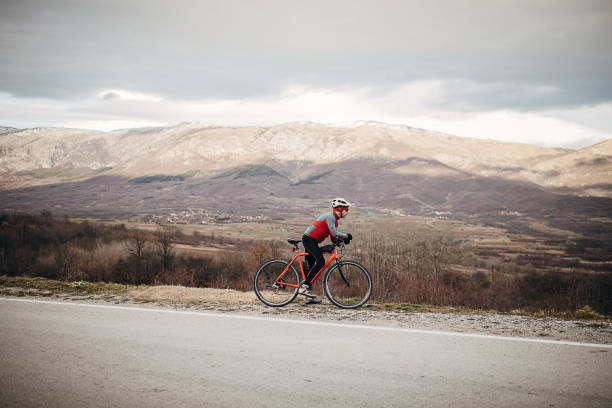 istock Professional cyclist resting by the road 1302461307