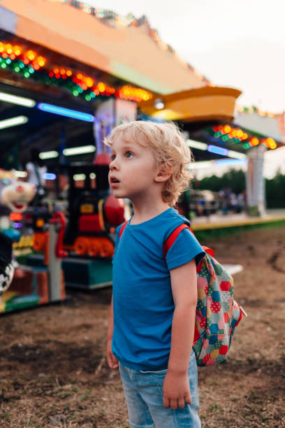 istock Enthusiastic Boy Looking At Luna Park 1302461352