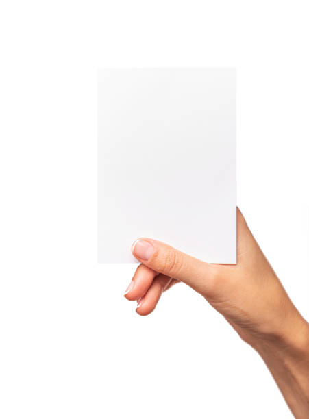 istock Female hand holds a white card isolated on white background. 1302461601