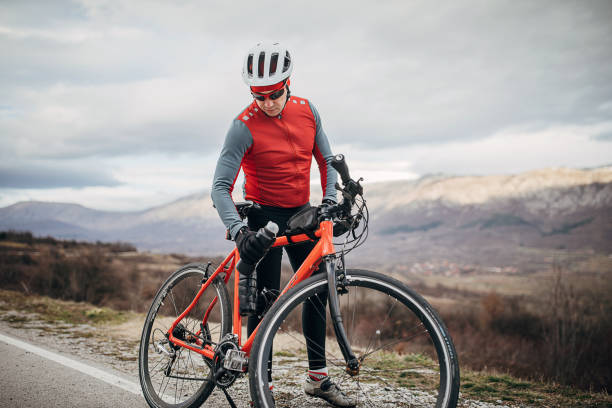 istock Professional cyclist resting by the road 1302462802