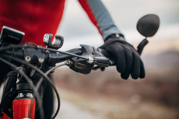 istock Male cyclist has fingers on a brake 1302463865