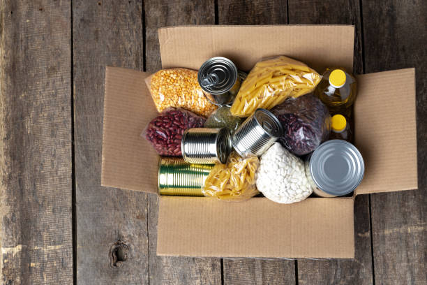 istock Food donations on the table. Text Donation. 1302463872