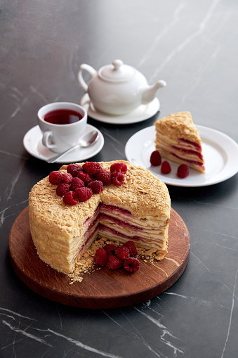 cut Mille-feuille, Cake Napoleon with raspberries jam. High quality photo