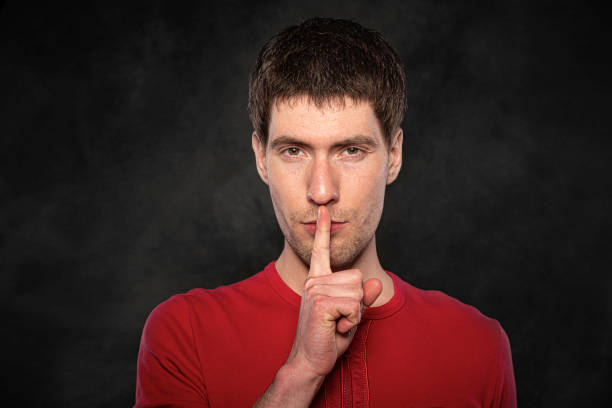 istock Funny young guy portrait isolated on dark background 1302466569