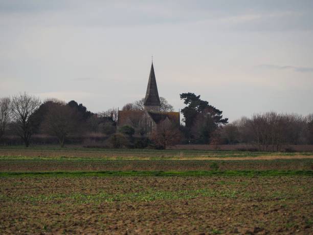 istock Field and Church 1302469059