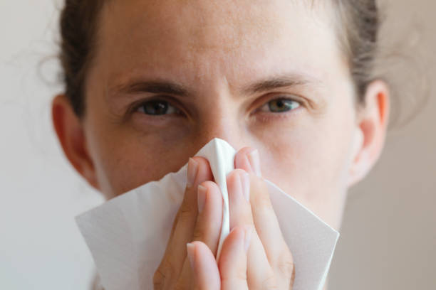 istock Women Cleaning Her Nose 1302469732