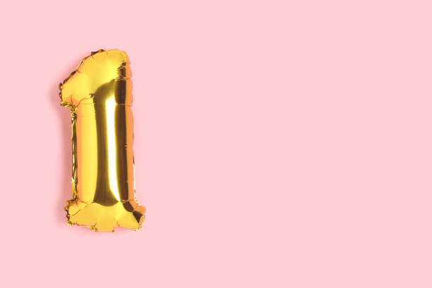 istock Number 1 golden balloon with copyspace. 1302470471
