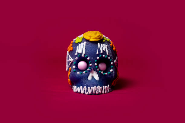 istock Sugar skull for day of the dead with pink background 1302470593