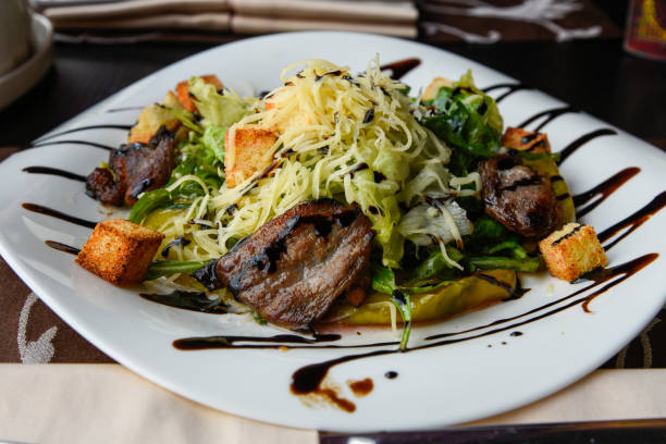 Smoked duck breast with cheese and fresh vegetable salad.