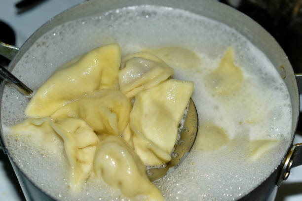 istock Meat dumplings cooked in a pot in the kitchen 1302471340