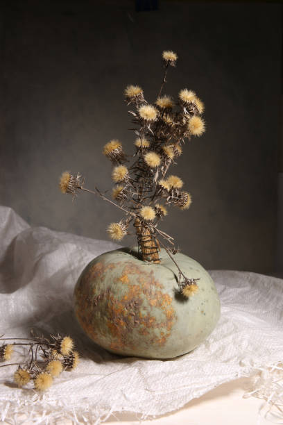 istock Still life with pumpkin and dried flowers. 1302471450