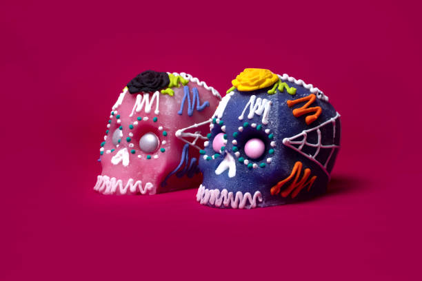 istock Sugar skull for day of the dead with pink background 1302471673
