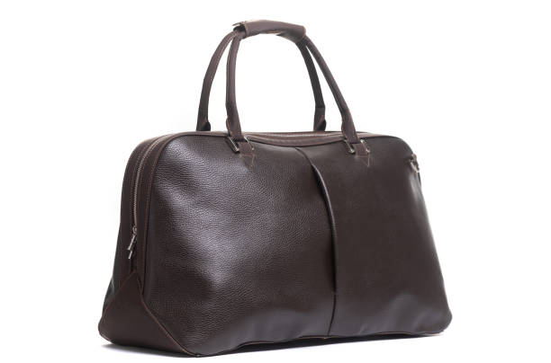 istock leather female brown bag on the handle sideways on a white background 1302472037