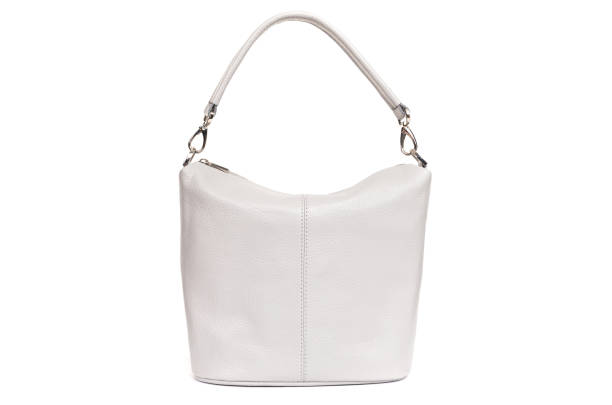 istock women cream leather bag isolated on white background 1302472056