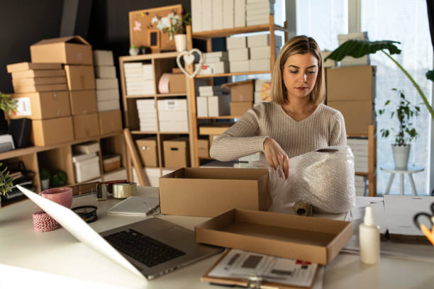 istock Wrapping a vase in bubble pack to protect if from braking during shipping 1302473131