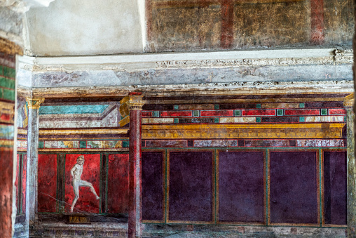 Mural fresco of the Villa of the Mysteries in the ruins of the ancient archaeological site of Pompeii, Italy