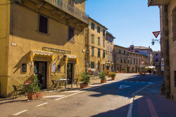 High Street in Santa Fiora, Tuscany Santa Fiora, Italy - September 5th 2020. Buildings in Via Roma, with Piazza Garibaldi in the background, in the historic medieval village of Santa Fiora in Grosseto Province, Tuscany crete senesi stock pictures, royalty-free photos & images