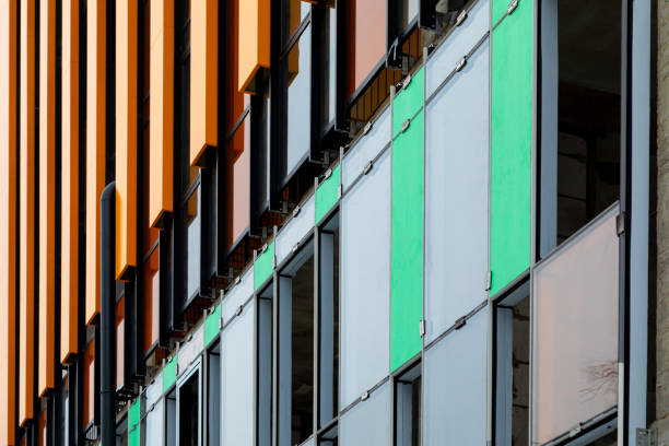 Finishing the facade of the building with a ventilated facade. A fragment of a residential building, hotel, hospital or other commercial property with glazed windows and building loess. Finishing the facade of the building with a ventilated facade. A fragment of a residential building, hotel, hospital or other commercial property with glazed windows and building loess. Diagonal. loess stock pictures, royalty-free photos & images