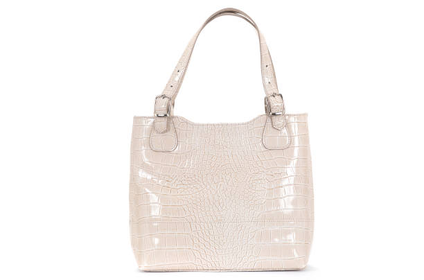istock women cream leather bag isolated on white background 1302476009