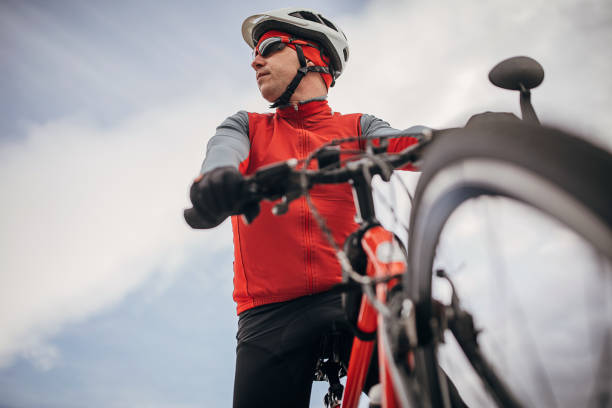 istock Professional male cyclist riding bicycle 1302476357