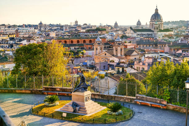 the roofs and domes of the historic heart of rome seen at sunset from the terrace of the pincio gardens - rome cityscape aerial view city imagens e fotografias de stock