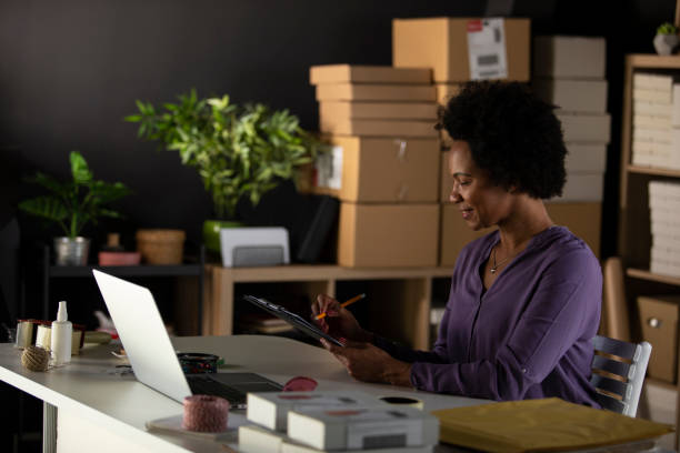 istock Checking things done on a to do list while working at the desk 1302477418