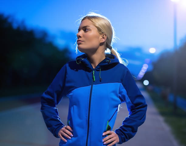 istock A young and beautiful female athlete resting body after jogging. 1302477570
