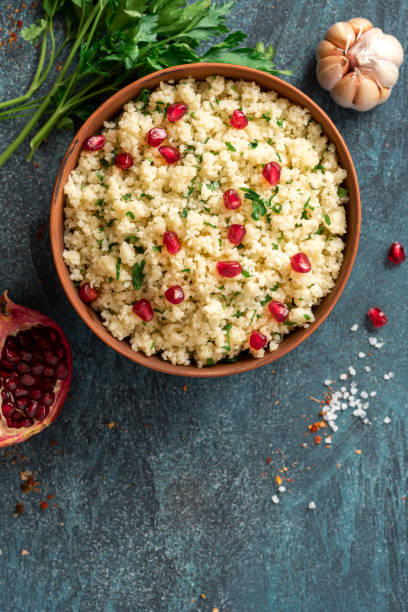 istock Cooked couscous with parsley and pomegranate 1302478778